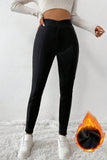 Leggings thermiques noirs à taille croisée et jambes cousues