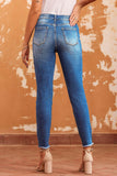 Jean skinny bleu à ourlet brut longueur cheville