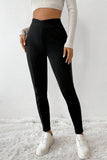 Leggings thermiques noirs à taille croisée et jambes cousues