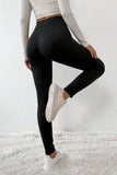 Leggings thermiques noirs à taille croisée et jambes cousues