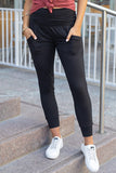 Legging noir à taille haute avec poches plissées